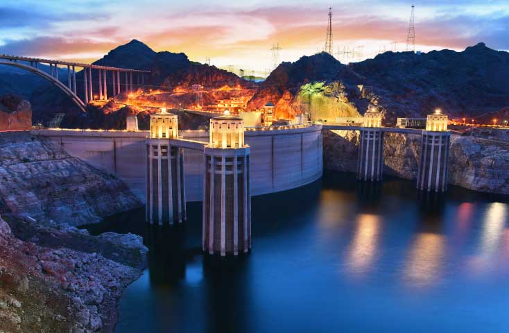 Hoover dam with the sun setting